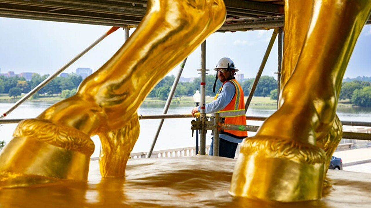 Trump unveils gleaming gold makeover of iconic DC horse statues War regilded base