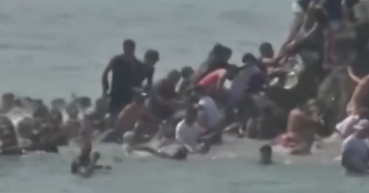 Spanish woman trembles in fear, pleads for help while surrounded by illegal migrants sg migrants in spain 1200x630 1
