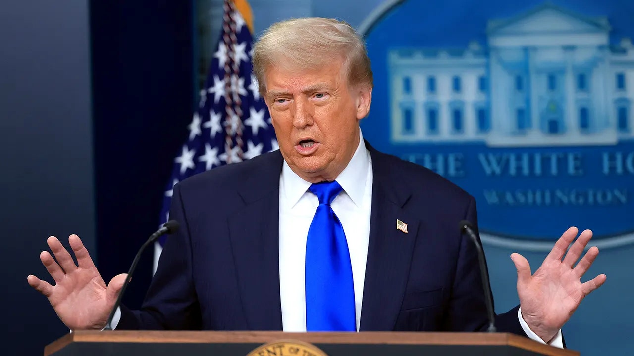 Hamas agrees to complete disarmament under 'historic' Gaza agreement: Trump trump speaks at a podium