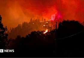 Fast-moving Canada wildfire doubles in size forcing thousands to flee homes