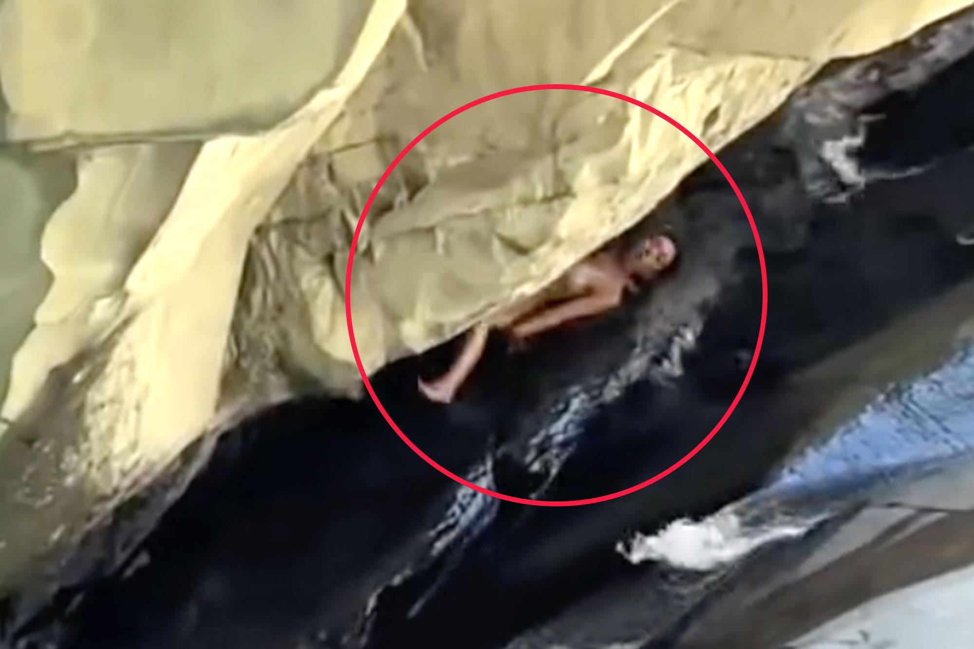Moment woman crunches herself on rocks at Santa Paula Punch Bowls in Ventura County 136298855