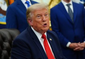 Trump gives remarks amid tariff battles, participates in signing time