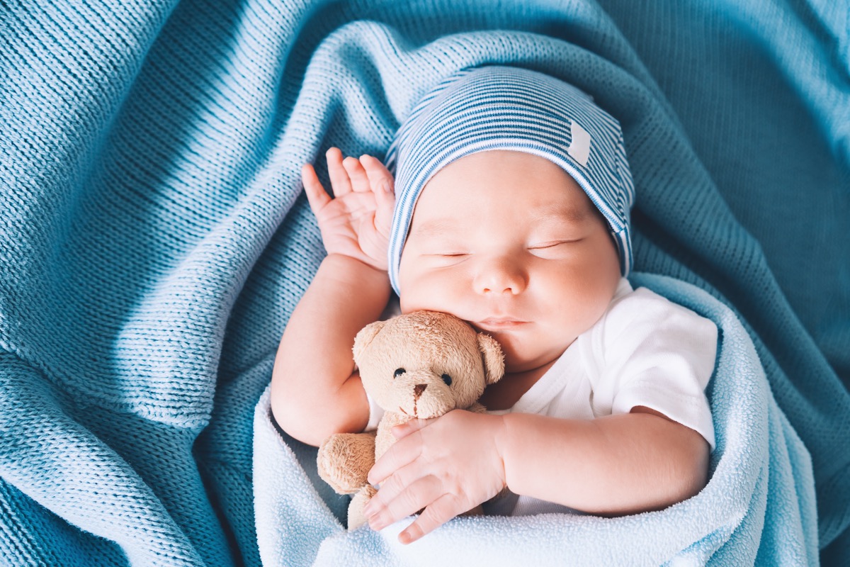 Couple Who Wanted Surrogate to Abort Their Child Take Custody After He’s Born Boy baby newborn with teddy bear 081526 Getty 1321458945
