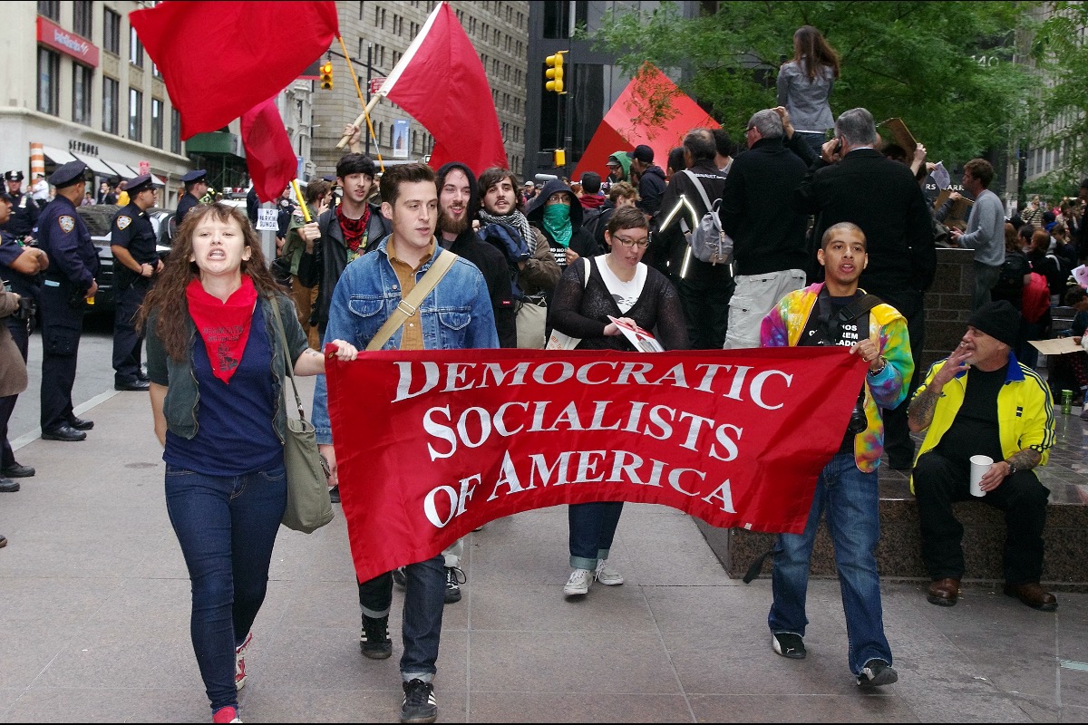 Ex-DSA Member: Democratic Socialists of America Now “Controlled by Communists” DSA march 111225 Wiki Com