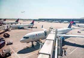 Passengers evacuate down  slide at ATL airport shortly after smoke forces emergency landing