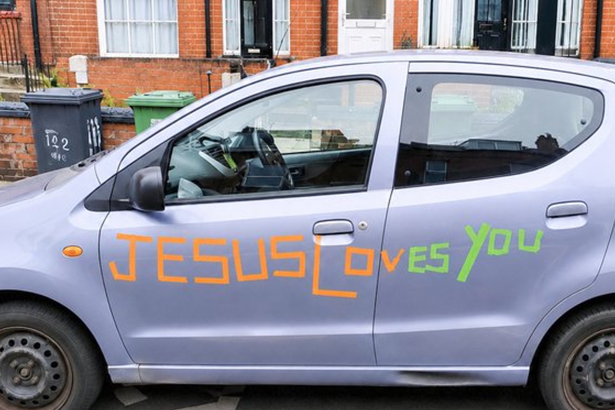 U.K. Drivers Must Choose Between Jesus and Insurance Simeon Chandra car Jesus Loves You 081726 X