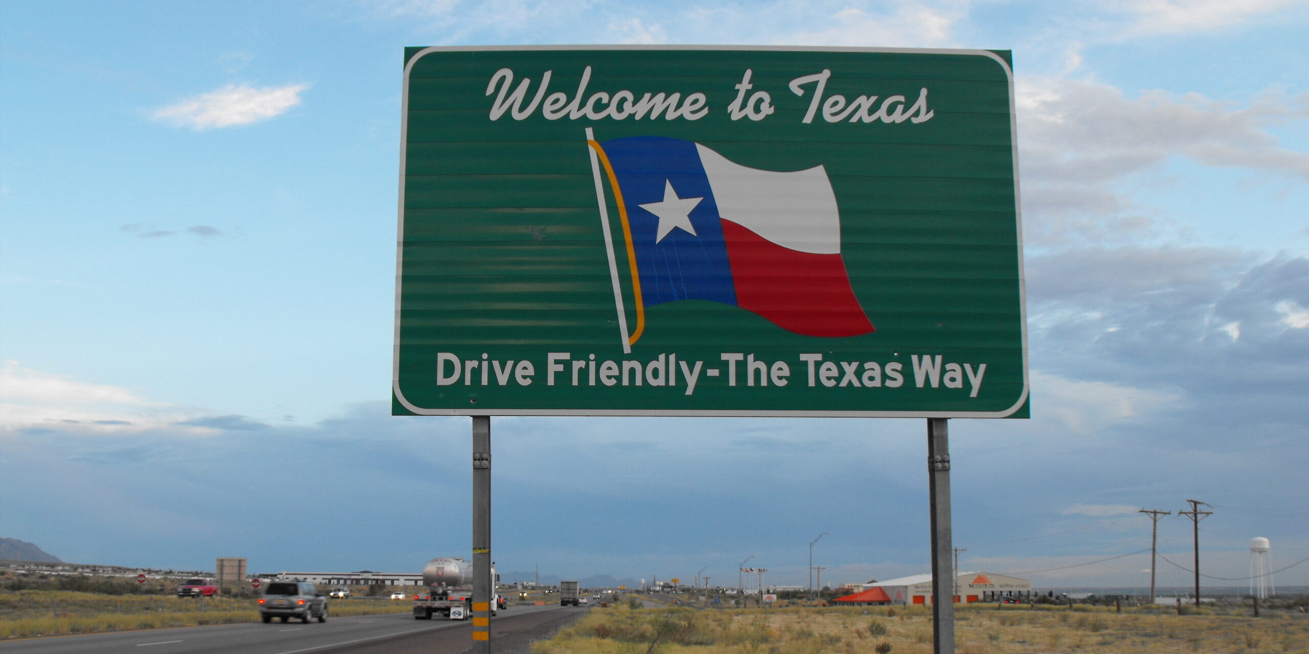 Texas Districts See Huge Surge in H-1B Visa Filings. Texas welcome sign scaled e1786643773800