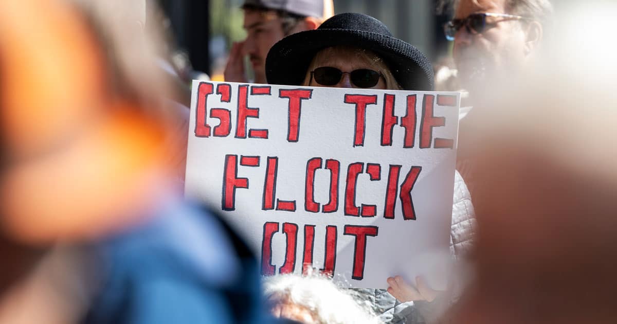 West Virginia Republicans Move to Ban Flock Cameras, Warn AI Surveillance Technology Threatens Fourth Amendment lock camera protester red states