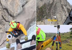 Dramatic moment paraglider who crashed into cliff is pulled to safety in harrowing rescue mission