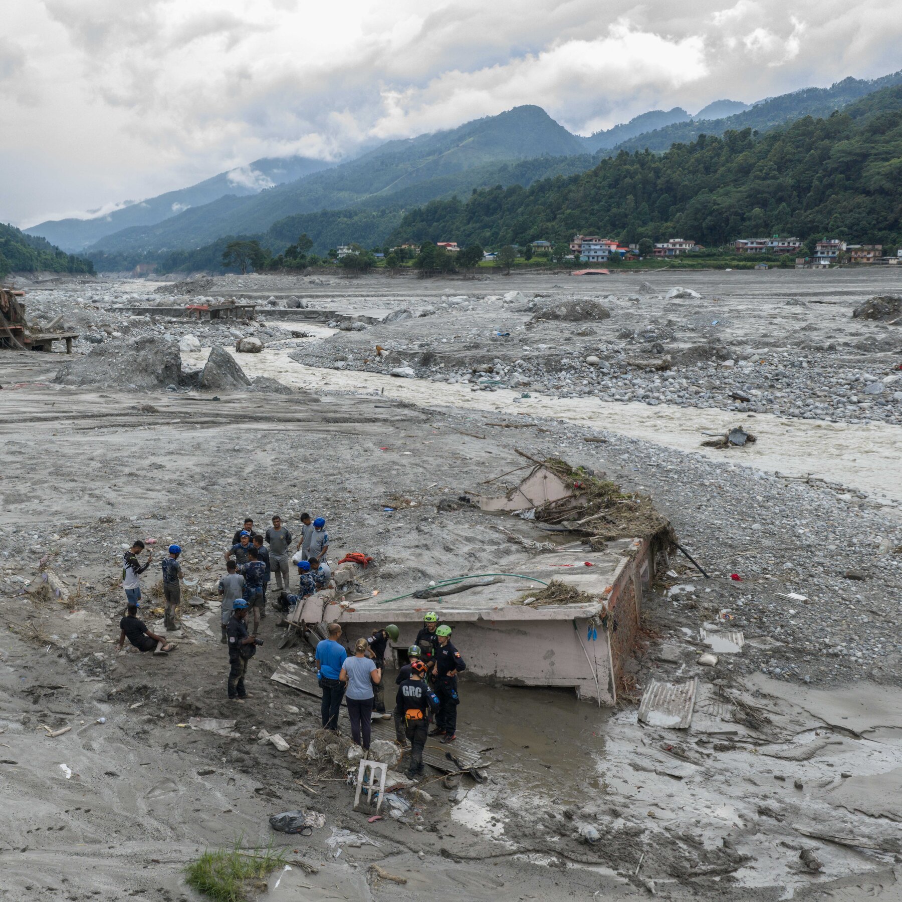 Nepal Floods Buried a House. The Woman Inside Was Still Alive. 05int nepal rescue scene 01 sub gjtv mediumSquareAt3X