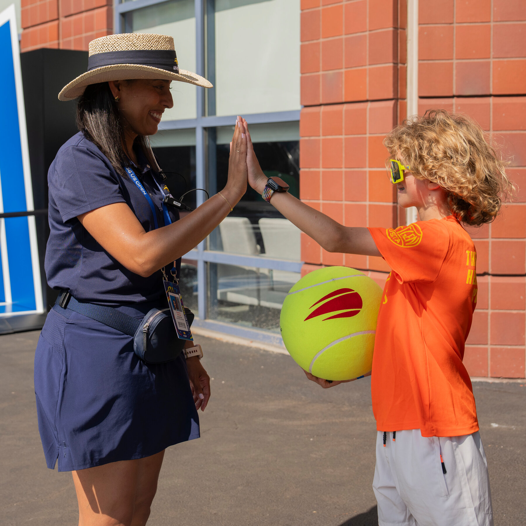 Lost at the U.S. Open? Find the Super-Cheerful People in Straw Hats. 09met us open ambassadors 09 jbtv mediumSquareAt3X v2