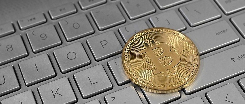 AI could suck air out of US Bitcoin mining industry 1024px Bitcoin on Laptop Keyboard e1770241436389 1024x437 1
