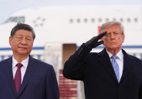 Trump winces during military flyover at Xi arrival ceremony