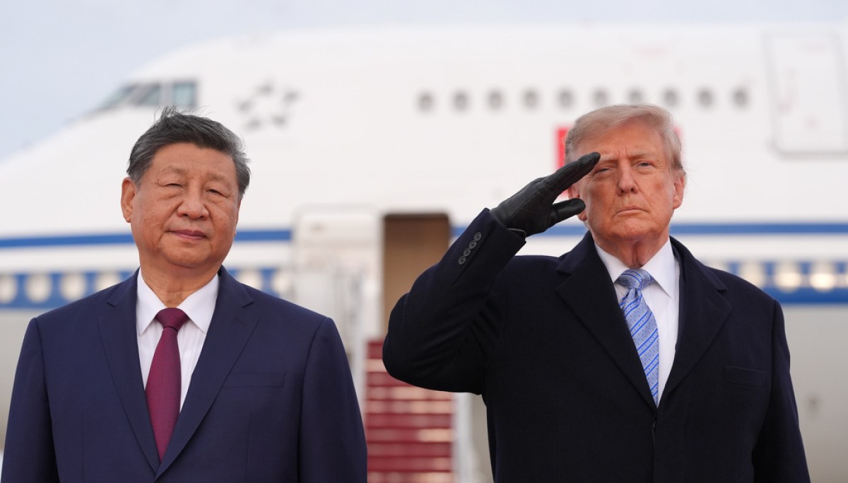 Trump winces during military flyover at Xi arrival ceremony AP26266801570640