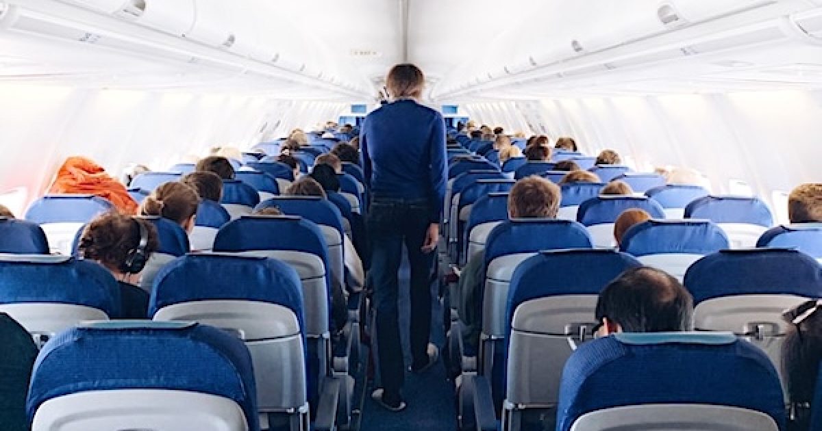 Woman strips naked in flight, performs ‘explicit, indecent’ acts in full view of other passengers lying legroom unsplash 1200x630 1