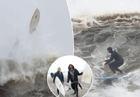 Surfers ignore nor’easter warnings and dangers, catch high waves off Rockaway Beach during nor’easter