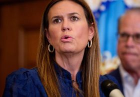 Sanders defiant as critics slam her welfare work requirement ad