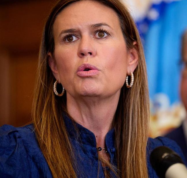 Sanders defiant as critics slam her welfare work requirement ad