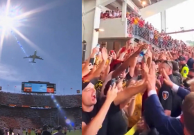 Trump Buzzes Over University of Tennessee Football Stadium on Air Force One, High Fives Fans in Roaring Crowd