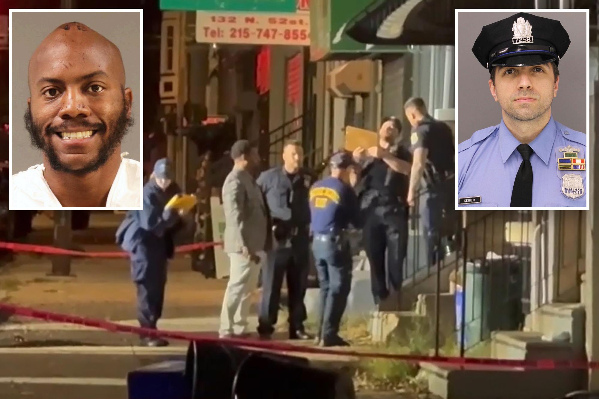 Suspect in deadly Philadelphia police ambush faces 76 charges, ordered held without bail 144741973