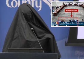 Woman wearing burka escorted out of Florida county meeting after playing call to prayer recording