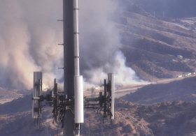 Fast-moving wildfire shuts down major California freeway as flames rage
