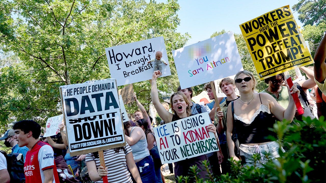 Foreign adversaries running 'psyop' to fuel anti-AI and anti-data center movement, war official says ai protest signs blurred