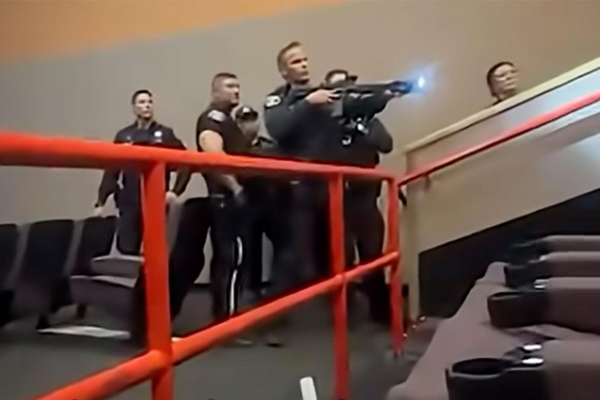 Wild moment armed cops storm California movie theater comp 1 3