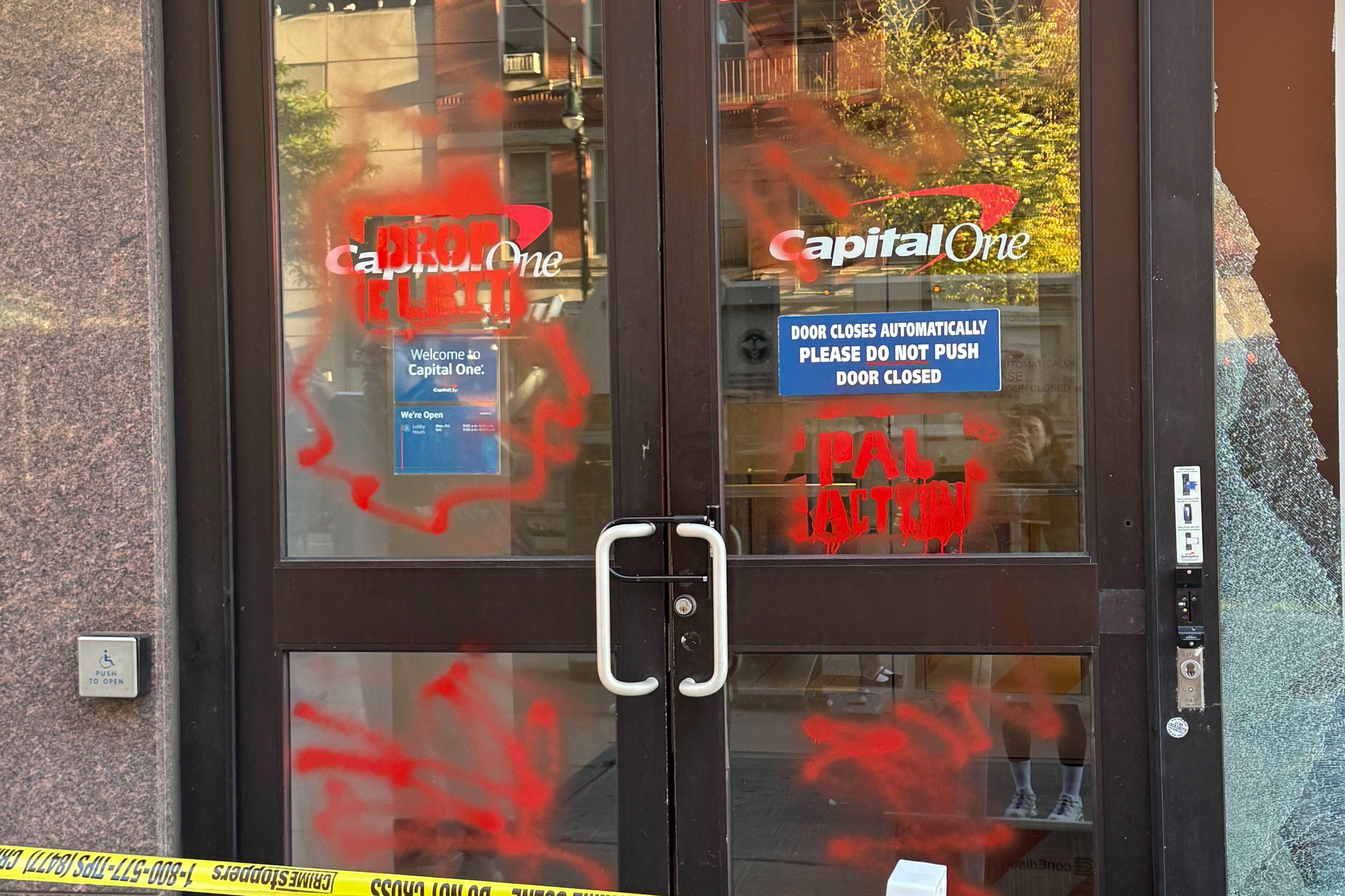 Window of UES bank smashed, facade marred with red graffiti in possible hate crime: cops crop 41404972