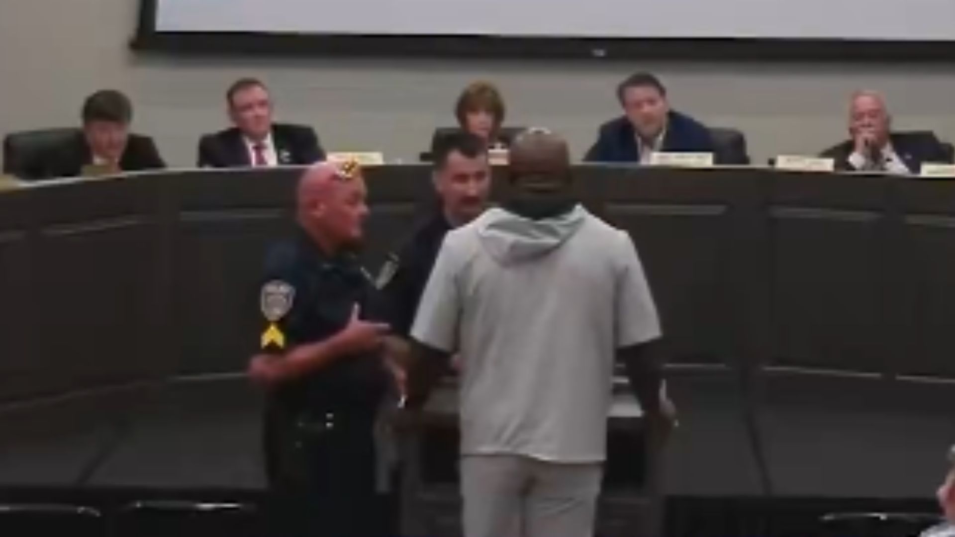 Pastor Removed by Police from School Board Meeting After Reading from Library Book in North Carolina d 43