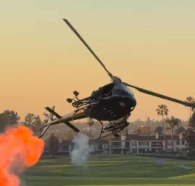 Stunt Chopper at Navy SEAL Fundraiser Thrills Guests With Small Explosions and Red, White and Blue Smoke Show