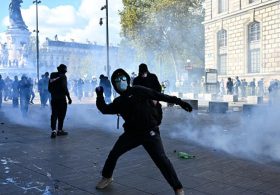 Protestors in French cities clash with police, break windows, block roads