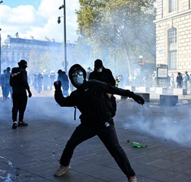 Protestors in French cities clash with police, break windows, block roads