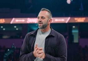 Costi Hinn makes history at Share the Arrows, urges wives to be ‘crowns’