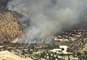 Wind-fueled wildfire breaks out in Malibu as power cut to thousands of homes