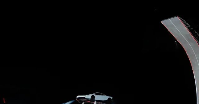 Musk Unveils Flying Tesla Roadster at SpaceX Texas Site lying roadster 640x335 1