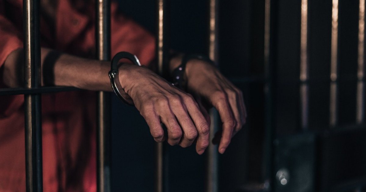 Did Christa Pike Help Executioners Find a Vein Before 2 Lethal Doses Failed? representative image person behind prison bars illustrating case tennessee death row inmate 3