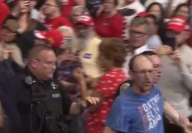 “Really Unattractive” Leftist Gets Clocked After Screaming at Trump at Rally – Trump Calls Supporter “Evander ‘The Real Deal’ Holyfield” – CROWD ROARS!