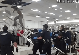 Punk pays the price after cops catch him crawling above department store ceiling
