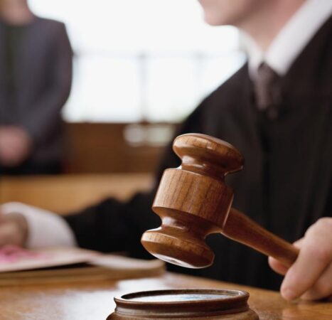 Three anti-Trump immigration protesters face trial after federal judge refuses to dismiss case