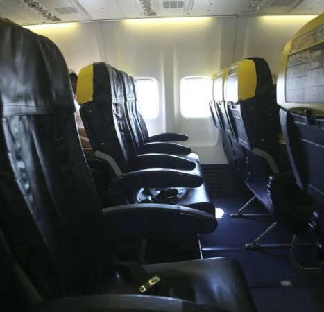 Passenger partially sucked out of window during plane flight — his wife and others held on to him