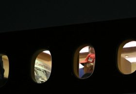 Trump appears to review poster about Kennedy Center demolition on Air Force One