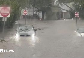 Flash flooding interrupts half-marathon and submerges cars