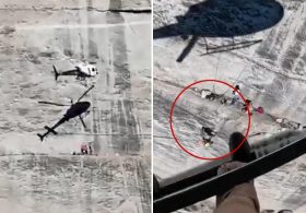 Harrowing moment helicopter hovers frighteningly close to cliff face to rescue fallen climber